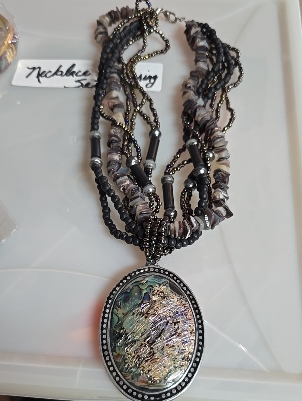 Artisan Made 22"T Multi-Strand Black Beaded Necklace with Abalone Oval Pendant